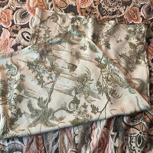 Long skirt, reached mid legs. Leave pattern, silky feeling and very comfortable.